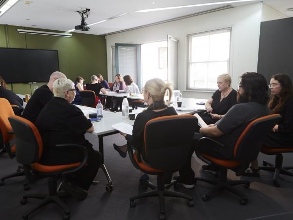 A group of volunteer managers sitting in on an educational event