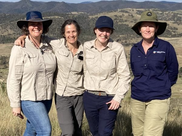 Katie Ronald with three of her volunteer coordinators outdoors.
